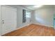 Bright bedroom featuring wood floors, neutral walls and white door at 108 Helen Dr, Summerville, SC 29483