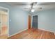 This bedroom has hardwood floors, a ceiling fan, and neutral paint at 108 Helen Dr, Summerville, SC 29483