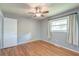 This cozy bedroom features hardwood floors and plenty of natural light at 108 Helen Dr, Summerville, SC 29483