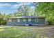 Rear view of a well-maintained single-story house featuring a tidy backyard at 108 Helen Dr, Summerville, SC 29483