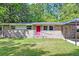 Brick home exterior with a red front door and a small front yard at 108 Helen Dr, Summerville, SC 29483