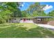Charming brick home featuring a carport and lush front yard at 108 Helen Dr, Summerville, SC 29483