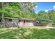 Charming brick home with a well-manicured lawn, covered carport, and lovely, mature trees in a desirable neighborhood at 108 Helen Dr, Summerville, SC 29483