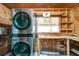 Convenient laundry room features a modern washer and dryer with extra storage space at 108 Helen Dr, Summerville, SC 29483