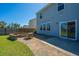Backyard featuring a stone fire pit, chairs, and a patio with a sliding glass door at 1110 Sapling Dr, Summerville, SC 29485