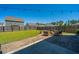 Serene backyard featuring a stone patio with fire pit and outdoor seating area under string lights at 1110 Sapling Dr, Summerville, SC 29485