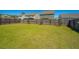 Backyard view of a large grassy space completely enclosed by a wood fence at 1110 Sapling Dr, Summerville, SC 29485