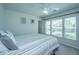Bright bedroom with striped bedding, ceiling fan, and natural light from the window at 1110 Sapling Dr, Summerville, SC 29485