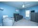 Charming Bedroom with blue walls, crib, glider, dresser, and ceiling fan at 1110 Sapling Dr, Summerville, SC 29485