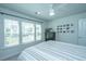 Comfortable bedroom features a striped bed, ceiling fan, and a window offering natural light at 1110 Sapling Dr, Summerville, SC 29485