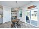 Charming dining area with modern lighting, sliding glass doors, and convenient access to the patio at 1110 Sapling Dr, Summerville, SC 29485