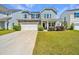 Beautiful two-story home features a two-car garage, manicured lawn, and attractive exterior details at 1110 Sapling Dr, Summerville, SC 29485