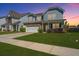 Charming two-story home with manicured lawn, two-car garage, and welcoming entrance, perfect for families at 1110 Sapling Dr, Summerville, SC 29485