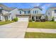 Inviting two-story home with a well-kept lawn, two-car garage, and a classic facade at 1110 Sapling Dr, Summerville, SC 29485