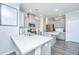 Bright kitchen with gray cabinets, stainless steel appliances, and spacious quartz countertops at 1110 Sapling Dr, Summerville, SC 29485