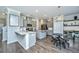 Modern kitchen with gray cabinets, stainless steel appliances, and stylish dining area at 1110 Sapling Dr, Summerville, SC 29485