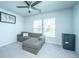Cozy living area featuring a gray sectional sofa, a ceiling fan, and carpet flooring at 1110 Sapling Dr, Summerville, SC 29485