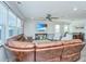 Open-concept living room featuring a brown leather sectional sofa, and a view of the dining area at 1110 Sapling Dr, Summerville, SC 29485
