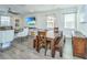 Open-concept living area with dining table, comfortable seating, and entertainment center at 1110 Sapling Dr, Summerville, SC 29485