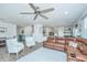 Expansive living space showcases kitchen, dining, and living areas in an open-concept design with wood floors at 1110 Sapling Dr, Summerville, SC 29485