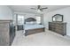 Bright main bedroom showcasing a large bed, neutral carpet and a complete set of dark-wood furniture at 1110 Sapling Dr, Summerville, SC 29485