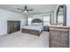 Spacious main bedroom with carpeted floors, ceiling fan and complete set of bedroom furniture at 1110 Sapling Dr, Summerville, SC 29485