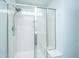 Bathroom shower with glass doors, a showerhead, and a built-in bench at 1110 Sapling Dr, Summerville, SC 29485