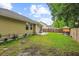 Expansive backyard featuring a large grassy area, partial fencing, and the home's exterior at 112 Red Cypress Dr, Goose Creek, SC 29445