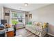 Bright bedroom/office with a daybed, desk, and a view of the neighborhood at 112 Red Cypress Dr, Goose Creek, SC 29445