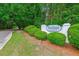 Attractive Woodland Lakes community sign surrounded by manicured landscaping at 112 Red Cypress Dr, Goose Creek, SC 29445