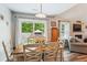 Charming dining area with hardwood floors, a wooden table, and backyard views, perfect for Gathering meals at 112 Red Cypress Dr, Goose Creek, SC 29445