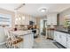 Charming kitchen features granite countertops, stainless appliances, and stylish pendant lighting over the breakfast bar at 112 Red Cypress Dr, Goose Creek, SC 29445