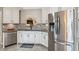 This kitchen has stainless steel appliances, a granite countertop, and an elegant gray tiled backsplash at 112 Red Cypress Dr, Goose Creek, SC 29445