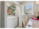 Practical laundry room with a washer and dryer and a window providing natural light at 112 Red Cypress Dr, Goose Creek, SC 29445