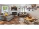 Living room with a fireplace and neutral decor and wood laminate flooring at 112 Red Cypress Dr, Goose Creek, SC 29445