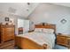 This main bedroom features wood furniture, patterned bedding, and a vaulted ceiling at 112 Red Cypress Dr, Goose Creek, SC 29445