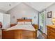 This main bedroom features wood furniture, patterned bedding, and a vaulted ceiling at 112 Red Cypress Dr, Goose Creek, SC 29445