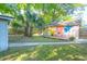 Spacious backyard featuring a shed with painted design and outdoor seating area at 1159 Camden St, North Charleston, SC 29405