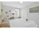 Bright bedroom featuring a ceiling fan, a desk and neutral colored walls and decor, creating a serene space at 1159 Camden St, North Charleston, SC 29405