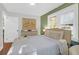 Comfortable bedroom with a neutral palette, hardwood floors, natural light, and stylish furnishings for a peaceful retreat at 1159 Camden St, North Charleston, SC 29405