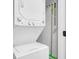 Functional laundry area featuring a stacked washer and dryer, ample storage, and a bright, clean design for efficiency at 1159 Camden St, North Charleston, SC 29405
