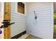 This outdoor shower features a wall-mounted shower head, a wood deck, and a privacy enclosure at 1159 Camden St, North Charleston, SC 29405