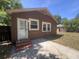Back view showing the door entrance and multiple windows that provide ample natural light at 117 Weiters St, Walterboro, SC 29488