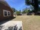 Spacious backyard with a concrete patio and a storage shed in a fenced area at 117 Weiters St, Walterboro, SC 29488