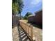 Fenced backyard featuring a newly-installed wooden gate for added security and privacy at 117 Weiters St, Walterboro, SC 29488