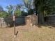 A tan shed in the backyard provides extra storage space for tools and outdoor equipment at 117 Weiters St, Walterboro, SC 29488