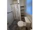 Compact bathroom with a patterned shower curtain at 117 Weiters St, Walterboro, SC 29488