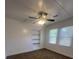 Bright bedroom features a ceiling fan and built in shelving at 117 Weiters St, Walterboro, SC 29488