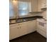 Modern kitchen featuring stainless steel sink, white appliances, and stylish fixtures at 117 Weiters St, Walterboro, SC 29488