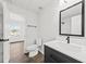 Modern bathroom featuring a black vanity, white countertops, and a large mirror at 122 Hornby Cir, Goose Creek, SC 29445